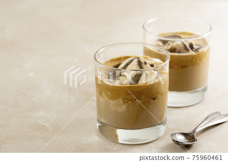 Affogato with Ice Cream, coffee glass with whipped cream and syrop, bright background 75960461