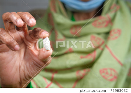 senior hand holding pills with copy space senior hand holding pills with copy space 75963082