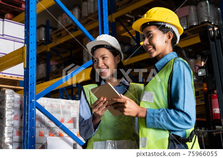 Female warehouse worker working at the storehouse 75966055