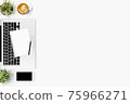 White office desk table with blank notebook, smartphone, laptop and supplies. Top view with copy space, flat lay. 75966271