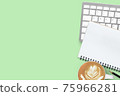 Green pastel office desk table with coffee, computer keyboard, notebook and pencil. Top view with copy space, flat lay. 75966281