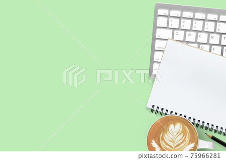 Green pastel office desk table with coffee, computer keyboard, notebook and pencil. Top view with copy space, flat lay. Green pastel office desk table with coffee, computer keyboard, notebook and pencil. Top view with copy space, flat lay. 75966281