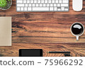 Wood hipster desk with computer gadgets and supplies. Top view with copy space, flat lay. 75966292