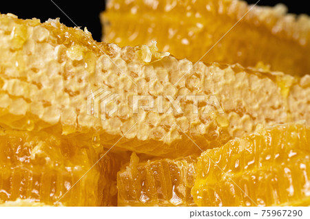 fresh closed honeycomb covered with wax on dark background fresh closed honeycomb covered with wax on dark background 75967290