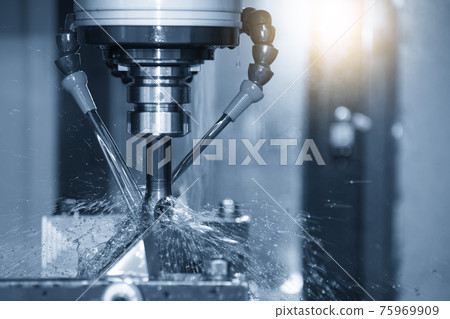 The CNC milling machine cutting the mold parts with oil coolant method. The mold and die manufacturing process by CNC machining center. The CNC milling machine cutting the mold parts with oil coolant method. The mold and die manufacturing process by CNC machining center. 75969909
