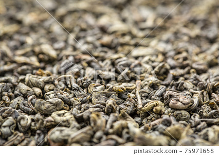 Gunpowder green tea background 75971658
