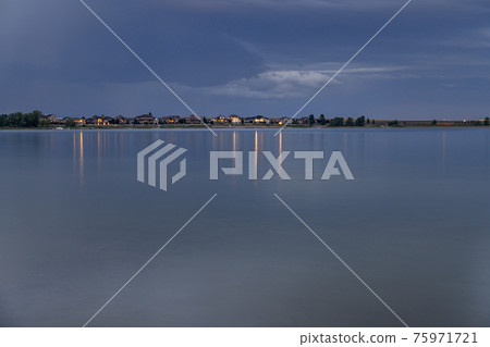 night over a calm lake in Colorado 75971721
