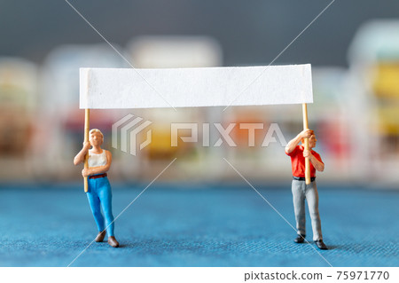 Miniature people, protesters holding signs, raising their hands 75971770