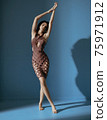 Fit, flexible dancer wearing a trendy, elegant dress 75971912