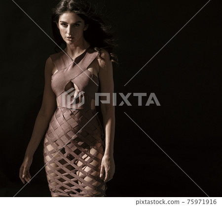 Portrait of a young, brunette, classy woman posing in shade Portrait of a young, brunette, classy woman posing in shade 75971916