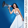 Elegant woman yelling with a bullhorn - communication concept 75971920