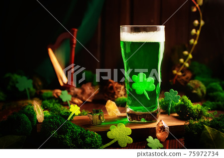 St. Patrick's Day Green Beer pint over wooden background 75972734