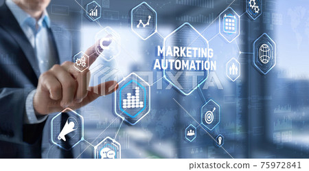 Marketing automation on the virtual screen. Man clicks on the inscription Marketing 75972841