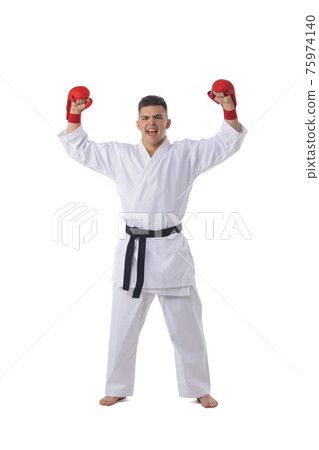 Man training taekwondo on white 75974140