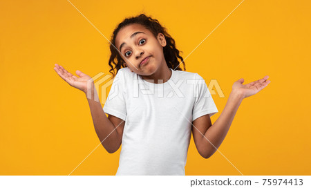 I Don't Know. Confused puzzled black girl shrugging at studio I Don't Know. Confused puzzled black girl shrugging at studio 75974413