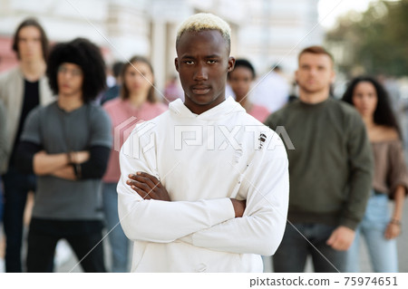 African american man leader standing over multiracial group of protestors African american man leader standing over multiracial group of protestors 75974651