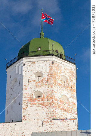White tower of Vyborg Castle on a sunny day 75975032