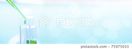 Chemical test tubes and pipette with green liquid close up in a chemical laboratory 75975033