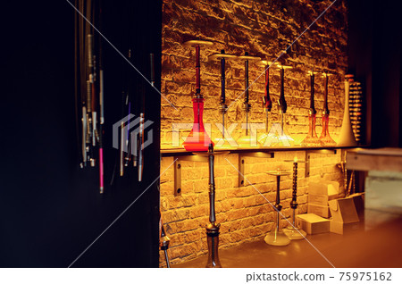Hookahs with glass bottles, shisha bar Hookahs with glass bottles, shisha bar 75975162