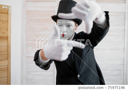 Male mime artist, photo camera gesture, parody Male mime artist, photo camera gesture, parody 75975196
