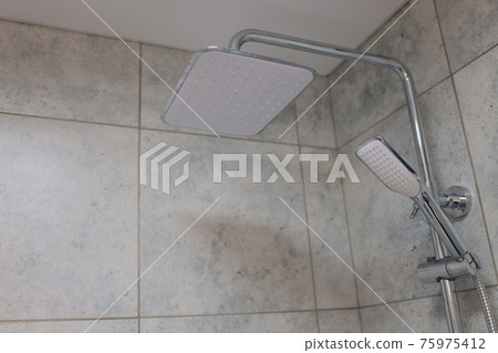 detail of a contemporary bath tub with luxury fixture. detail of a contemporary bath tub with luxury fixture. 75975412