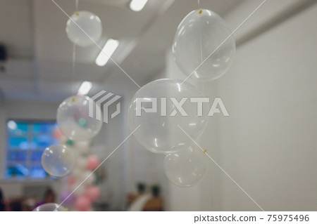 White And Transparent Balloons On Brick Wall Background. 75975496