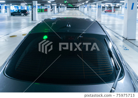 Parking space. Empty road asphalt background. Car lot parking space in underground city garage. Hidden underground carpark. 75975713