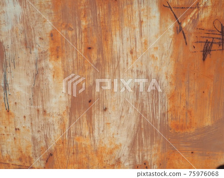 rusty scratched metal. The metal surface has long been painted yellow-orange. Rust and damage. Wear over time and use rusty scratched metal. The metal surface has long been painted yellow-orange. Rust and damage. Wear over time and use 75976068