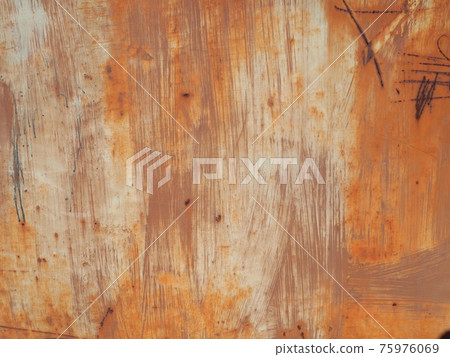 rusty scratched metal. The metal surface has long been painted yellow-orange. Rust and damage. Wear over time and use rusty scratched metal. The metal surface has long been painted yellow-orange. Rust and damage. Wear over time and use 75976069