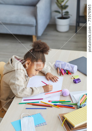 African Girl Drawing at Desk African Girl Drawing at Desk 75976965