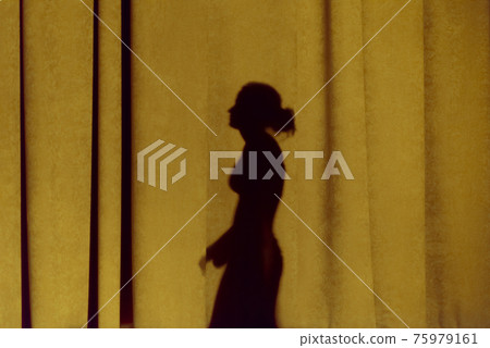 Shadow dancing on the curtain. Reflection dance on colored fabric. Shadow dancing on the curtain. Reflection dance on colored fabric. 75979161