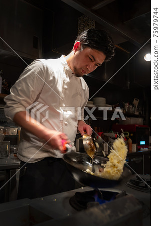 Chef cooking in the kitchen 75979744