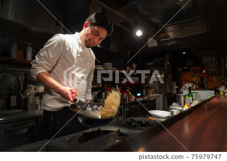 Chef cooking in the kitchen Chef cooking in the kitchen 75979747