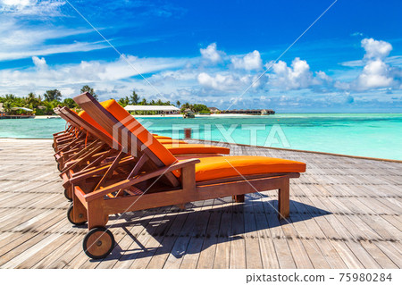 Wooden sunbed in the Maldives 75980284