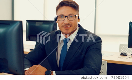 Business people wearing headset working in office 75981994