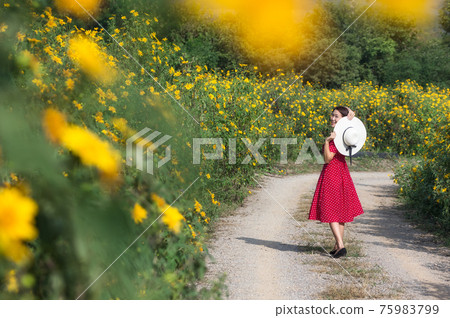 Beautiful woman in nature flower. Beautiful woman in nature flower. 75983799