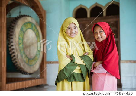 Kids woman Muslim pose looking at cameras 75984439
