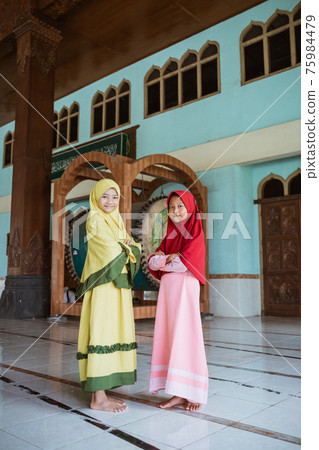 Kids woman Muslim pose looking at cameras 75984479