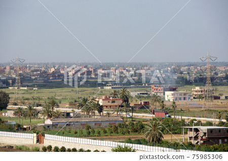 Cityscape seen from a passenger ship while sailing on the Suez Canal 75985306