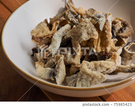 Asian food fried fish skin 75985423
