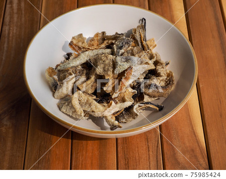 Asian food fried fish skin 75985424