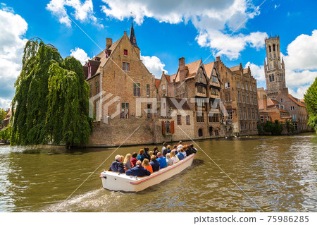 Canal in Bruges and Belfry tower 75986285