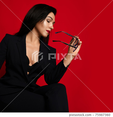 Adult sexy-looking brunette woman in official 75987360