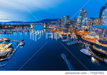 Beautiful view of Vancouver downtown skyline at sunset time, False Creek Harbour, British Columbia, Canada. Beautiful view of Vancouver downtown skyline at sunset time, False Creek Harbour, British Columbia, Canada. 75987802