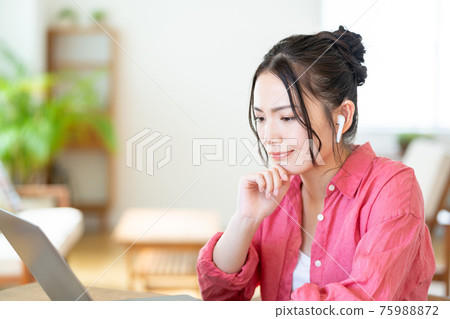 Young woman doing telework in the living room 75988872