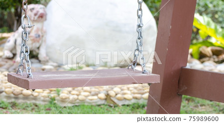 Swing for relaxing in the outdoor garden. Swing for relaxing in the outdoor garden. 75989600
