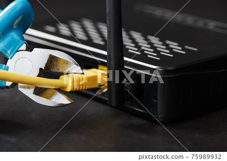 Cutting and disconnecting the network Internet connection with cutting pliers. 75989932