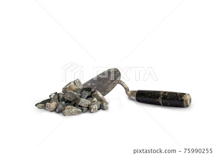 Stones used in conjunction with cement, including trowel, are used for separate construction on a white background. Stones used in conjunction with cement, including trowel, are used for separate construction on a white background. 75990255