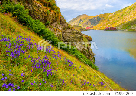 Beautiful volcanic Balea lake at high altitude, on Fagaras mountain, Romania 75991269