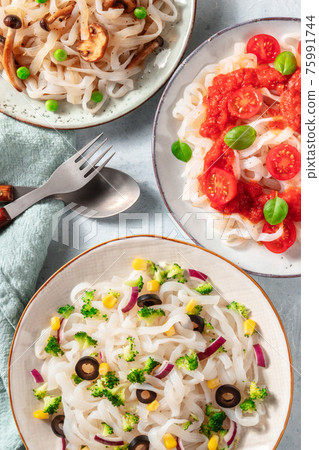 Konjac pasta with various toppings, overhead close-up shot Konjac pasta with various toppings, overhead close-up shot 75991744